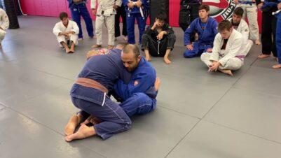 Butterfly-guard-sweep-from-the-underover-position-for-BJJ